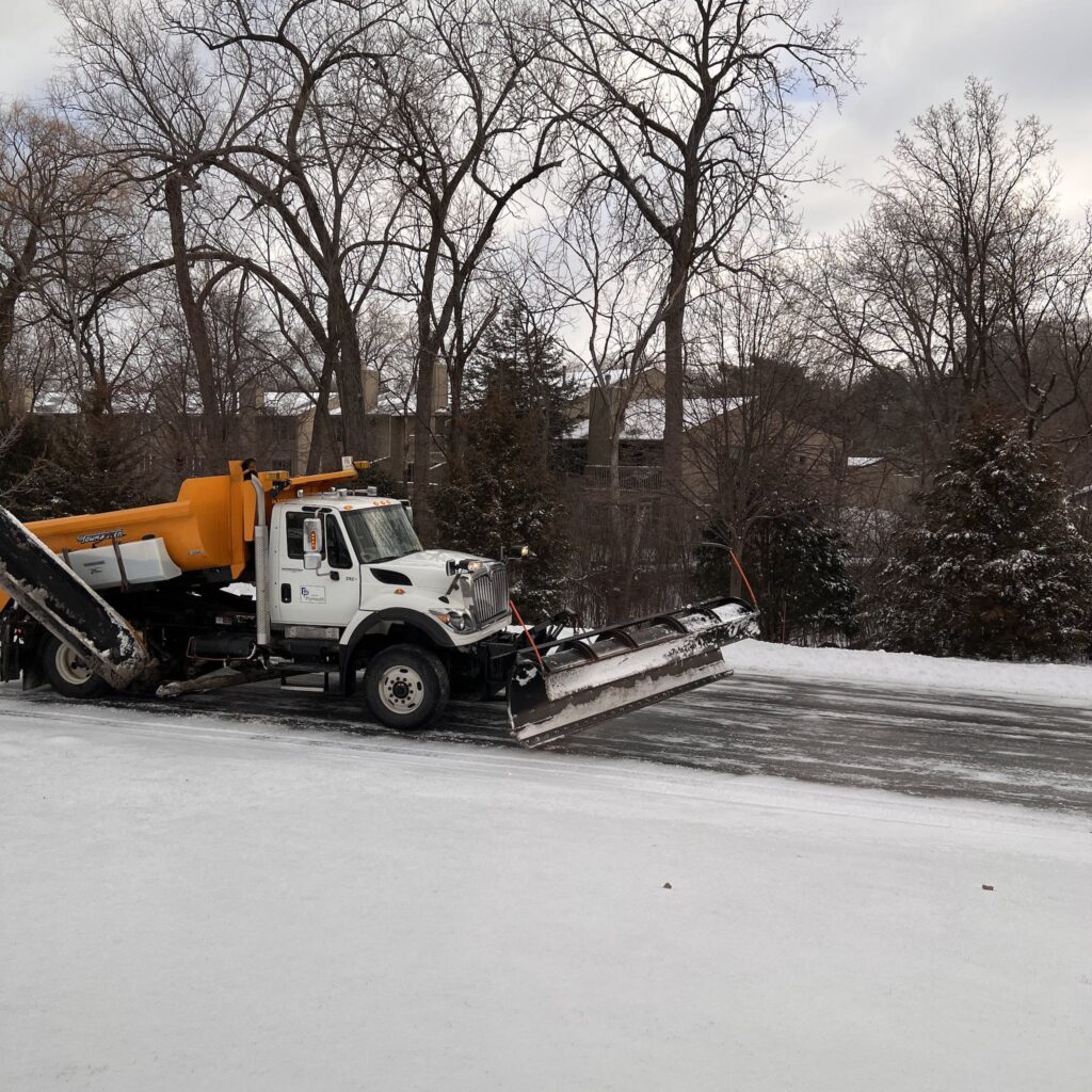 A Truck Plowing Snow